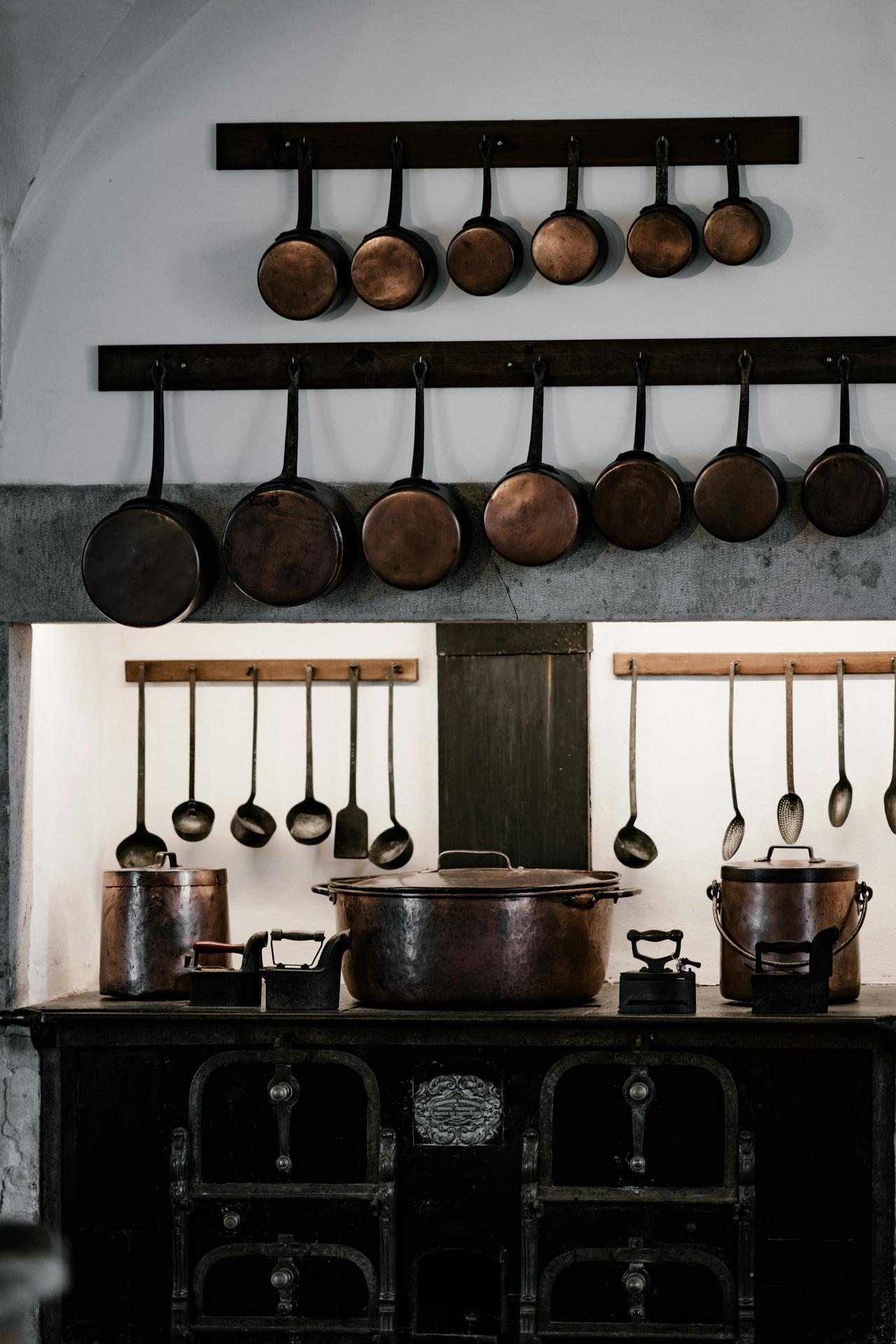 Metal cookware and utensils in a kitchen